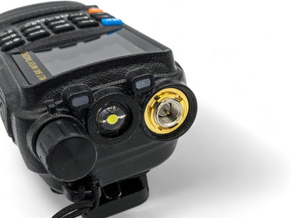 Handheld Amateur / GMRS radio with an SMA Male connector which connects to an SMA Female Adapter